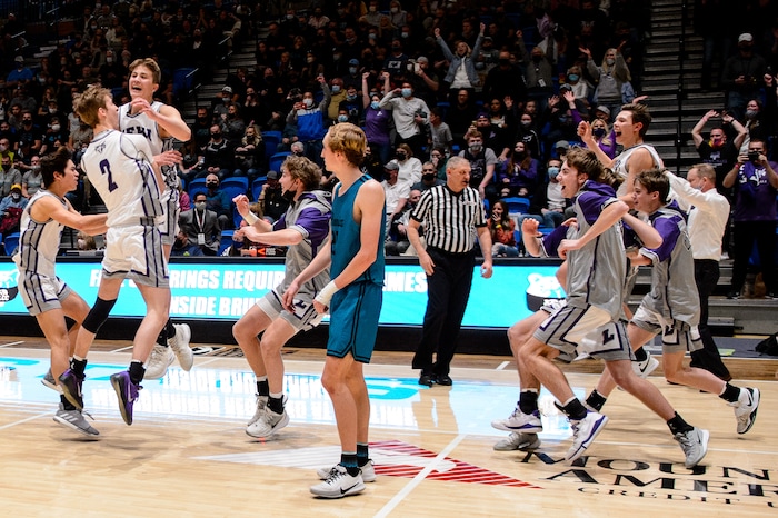 (Trent Nelson | The Salt Lake Tribune) Lehi players celebrate a win over Farmington High School in the 5A boys basketball state championship game, in Taylorsville on Saturday, March 6, 2021.