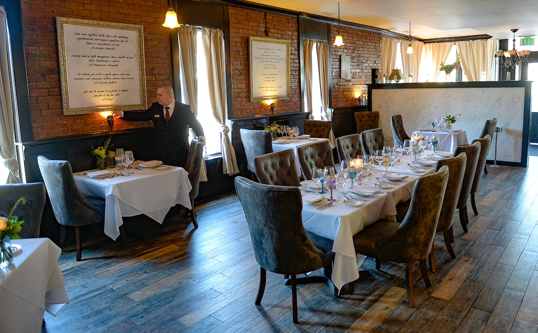 (Francisco Kjolseth  |  The Salt Lake Tribune) Manager Gustavo Mirenda prepares the dining room at the new La Trattoria di Francesco Ñ the newest Italian concept from the Sicilia Mia chain of restaurants at 1500 S. 1500 East, in Salt Lake City.