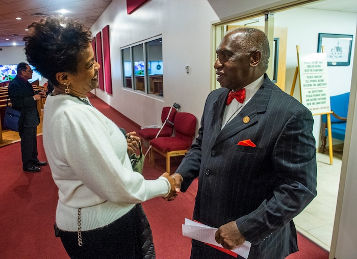 (Rick Egan  |  The Salt Lake Tribune)   Michele Johnson shakes hands with Rev. France Davis after the early morning worship service at Calvary Baptist Church, Sunday, Dec. 22, 2019.