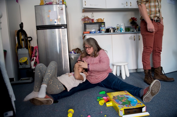 (Jeremy Harmon  |  The Salt Lake Tribune) Volunteer Tiffany Young plays with 7-year-old Yaretzi in the Chavez family's room at the First Unitarian Church on 1300 East in Salt Lake City on Dec. 14, 2018.