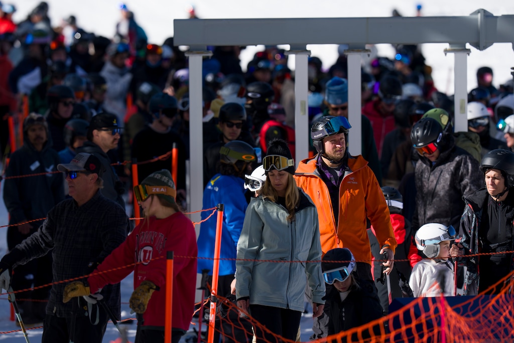 (Bethany Baker  |  The Salt Lake Tribune) People wait in line for the lift during opening day at Solitude Mountain Resort in Brighton on Thanksgiving Day.