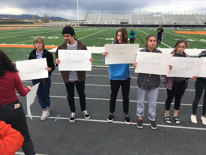 (Scott Sommerdorf  |  The Salt Lake Tribune) Students at Brighton High School in Cottonwood Heights hold cards with the names of those killed during a school shooting in  Parkland, Fla., as they participate in a nationwide demonstration for better gun safety laws on March 14, 2018.