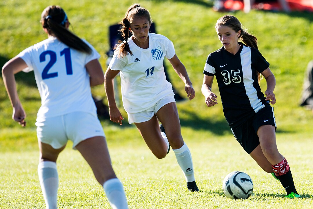 (Chris Detrick  |  The Salt Lake Tribune)  Syracuse's Caroline Stringfellow (35) runs past Fremont's Karlie Valdez (11) during the game at Fremont High School Thursday, October 5, 2017. 