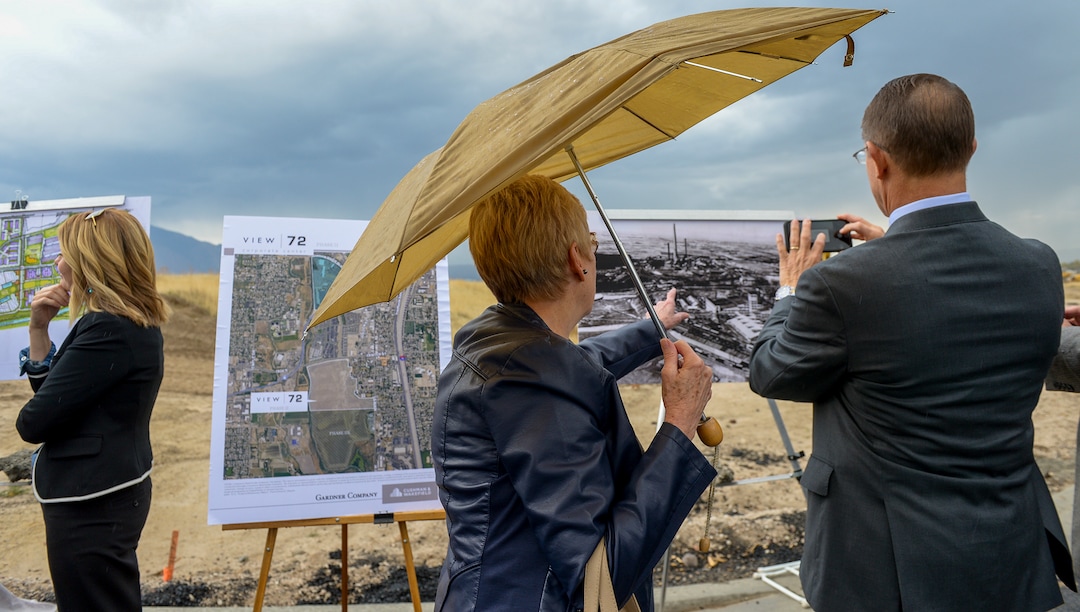 Leah Hogsten  |  The Salt Lake Tribune  l-r Jan Litster and Ken Ivory, R-West Jordan look at an old photograph of the Sharon Steel mill that operated on the site from 1906 to 1971 after the Midvale ceremony, Monday, Oct. 22, 2018. Jordan Bluffs is moving forward with the View 72, Phase II development at Jordan Bluffs. The 265-acre parcel will be comprised of mixed-use development on the former Sharon Steel superfund industrial site.