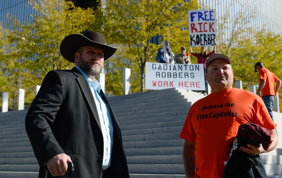 (Francisco Kjolseth  |  The Salt Lake Tribune)  Ammon Bundy, left, is joined by Roger Roots and other supporters of convicted fraudster Rick Koerber, as they gather ahead of his court sentencing in Salt Lake City at the Federal Courthouse on Tuesday, Oct. 15, 2019, ending a nearly two decade white collar crime saga.
