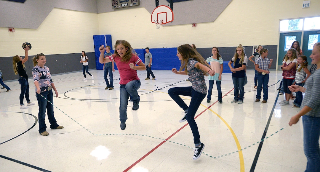 (Al Hartmann  |  The Salt Lake Tribune) Older girls do doubles jump roping at recess in the gym after lunch at Park Valley School.