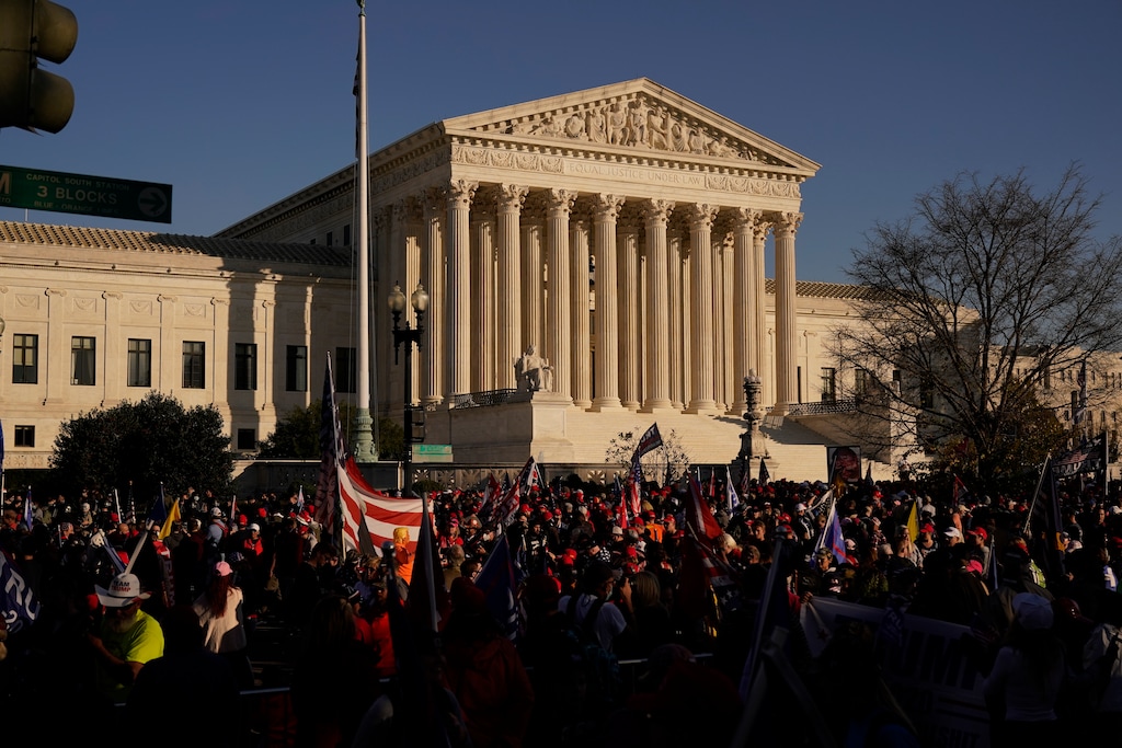 FILE - In this Nov. 14., 2020, file photo supporters of President Donald Trump attend pro-Trump marches outside the Supreme Court Building in Washington. (AP Photo/Jacquelyn Martin, File)