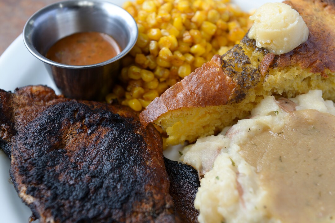 (Leah Hogsten  |  The Salt Lake Tribune)  Sauce Boss Southern Kitchen's blackened pork chops seasoned and seared served with Chef Julius Thompson's soul sauce, $11.85. Thompson is expressing his love for his Southern roots at his restaurant, Sauce Boss Southern Kitchen, Sept. 10, 2019.