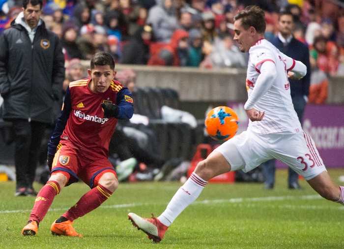 (Rick Egan  |  The Salt Lake Tribune)      Real Salt Lake forward Jefferson Savarino (7) kicks the ball, as New York Red Bulls midfielder Aaron Long (33) defends, in MLS action between Real Salt Lake and New York Red Bulls at Rio Tinto Stadium, Saturday, March 17, 2018.


