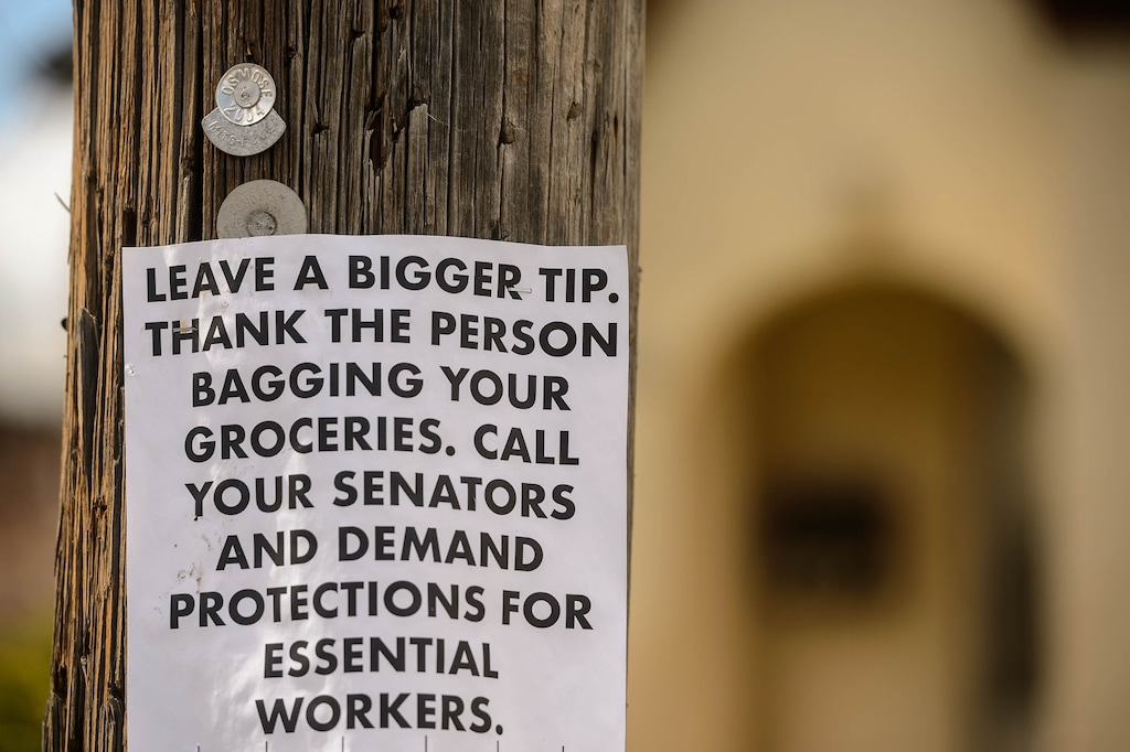 (Trent Nelson  |  The Salt Lake Tribune) A flyer in front of a Salt Lake City home urges citizen to support essential workers, on Monday, March 30, 2020.
