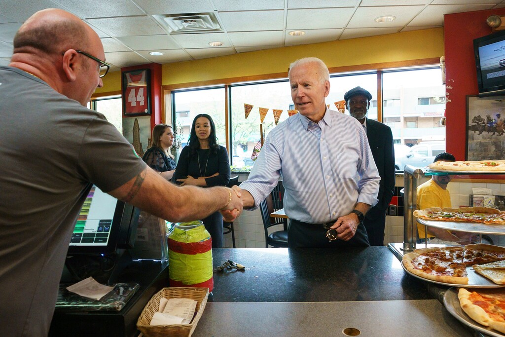 Democratic presidential candidate and former Vice President Joe Biden greets people at Gianni's Pizza, in Wilmington Del., Thursday, April 25, 2019. Jessica Griffin/The Philadelphia Inquirer via AP)