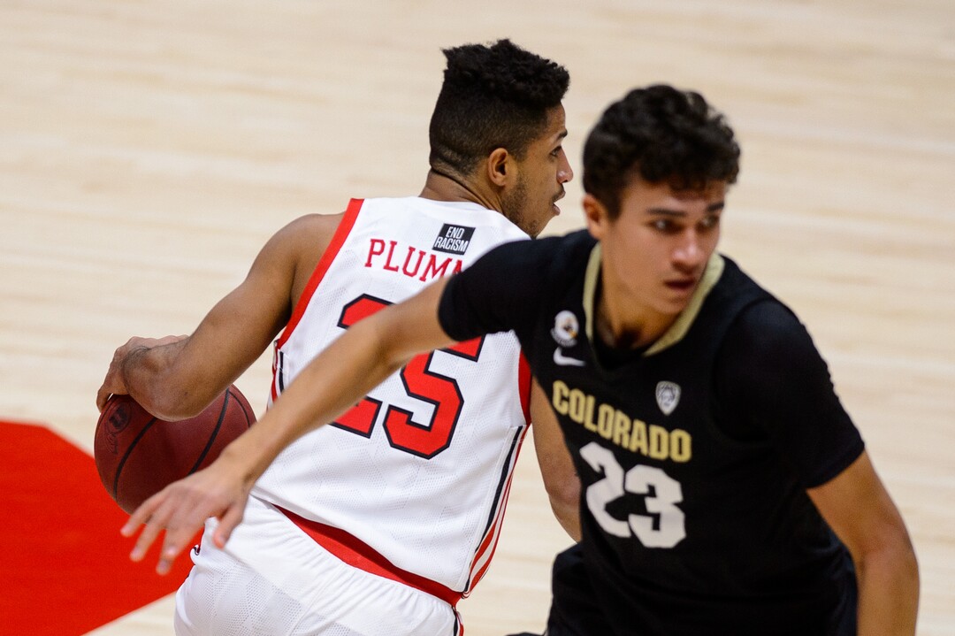 (Trent Nelson  |  The Salt Lake Tribune) Utah Utes guard Alfonso Plummer (25) defended by Colorado Buffaloes forward Tristan da Silva (23) as Utah hosts Colorado, NCAA basketball in Salt Lake City on Monday, Jan. 11, 2021.