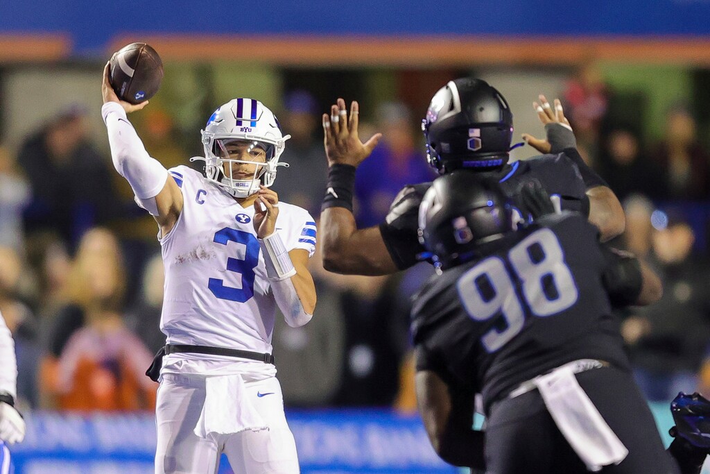 (Steve Conner | AP) BYU quarterback Jaren Hall (3) looks to throw under pressure from the Boise State defense in the second half of an NCAA college football game, Saturday, Nov. 5, 2022, in Boise, Idaho.