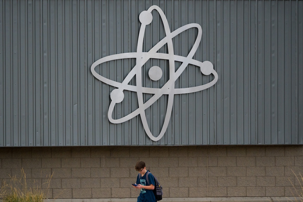 (Trent Nelson | The Salt Lake Tribune) A student checks his phone after school lets out at Centennial Jr. High School in Kaysville on Wednesday, Dec. 20, 2023.