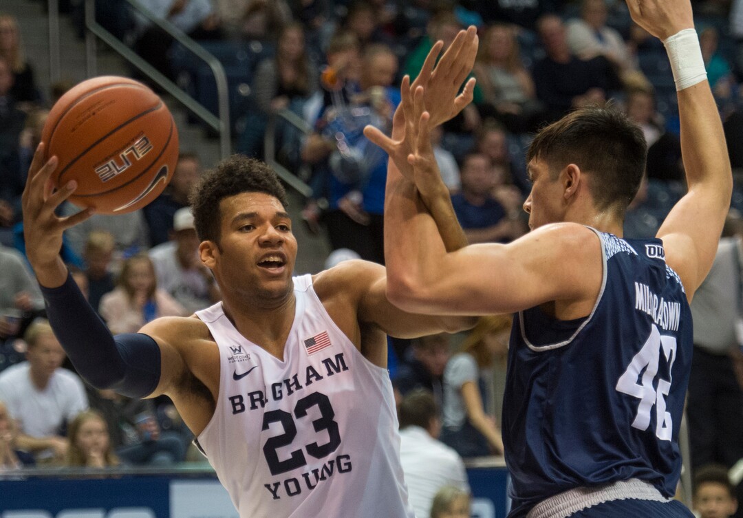 (Rick Egan  |  The Salt Lake Tribune)   Brigham Young Cougars forward Yoeli Childs (23) works for a shot, as Rice Owls forward Quentin Millora-Brown (42) defends, in basketball action between Brigham Young Cougars and Rice Owls, at the Marriott Center in Provo, Wednesday, Nov. 21, 2018.