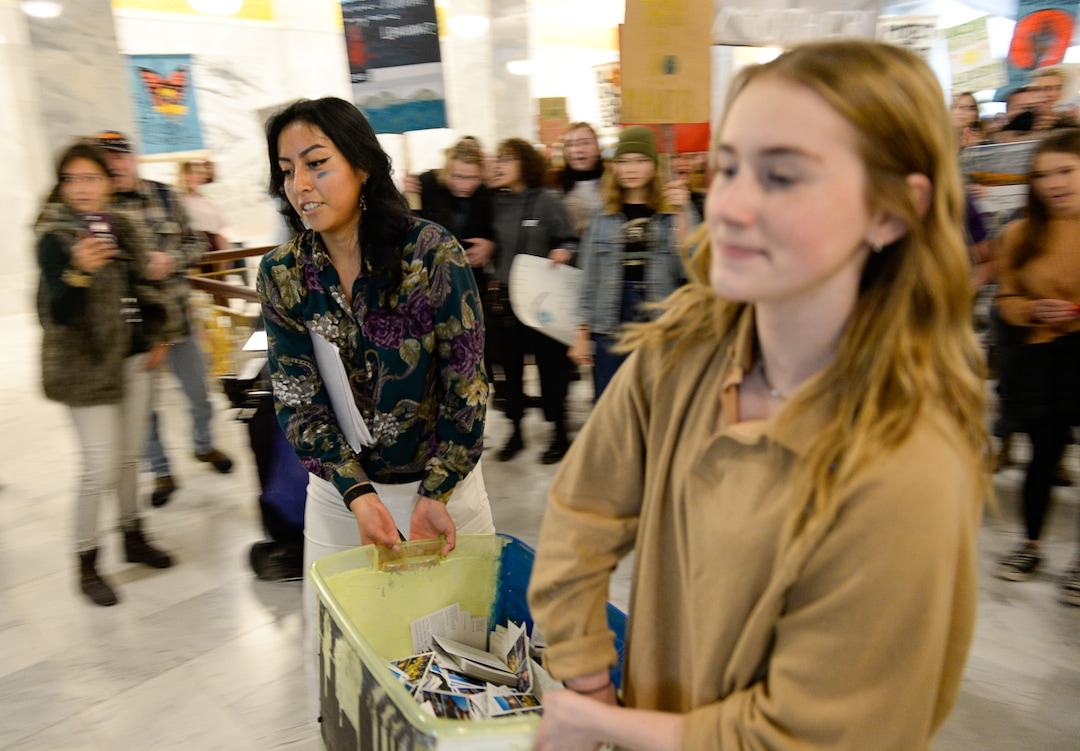 (Francisco Kjolseth  |  The Salt Lake Tribune)  Raquel Juarez, left, and Nina Serafin, are joined by numerous other students outside the office of Gov. Gary Herbert on the Utah Capitol on Friday, Dec. 6, 2019, as they deliver over 4,000 written cards with the importance of protecting Utah lands and clean air solutions. Because of security reasons they were told they would have to mail the cards instead. Fridays For Future, Utah Youth Environmental Solutions, and partners strike in opposition to UtahÕs final oil and gas lease sale of 2019 that will auction off public lands and further fossil fuel development.
