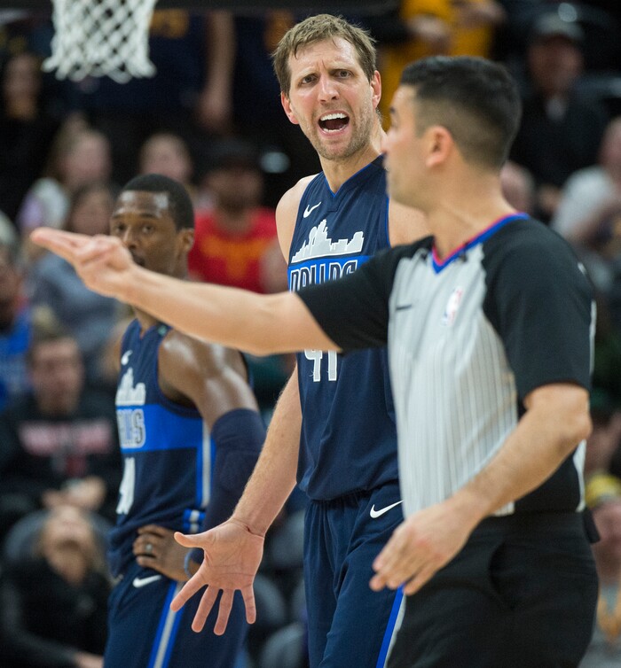 (Rick Egan  |  The Salt Lake Tribune)    Dallas Mavericks forward Dirk Nowitzki (41) reacts to a call by the official, after colliding with Utah Jazz guard Ricky Rubio (3), He was called for a technical foul on the play, in NBA action between Utah Jazz and Dallas Mavericks in Salt Lake City, Saturday, Feb. 24, 2018.