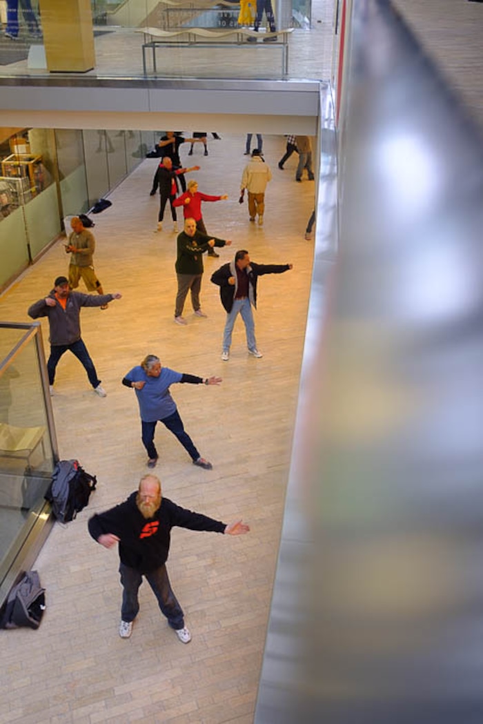 (Trent Nelson | The Salt Lake Tribune)  
A group of homeless people practice tai chi at the Main Library in Salt Lake City on Wednesday April 3, 2019.