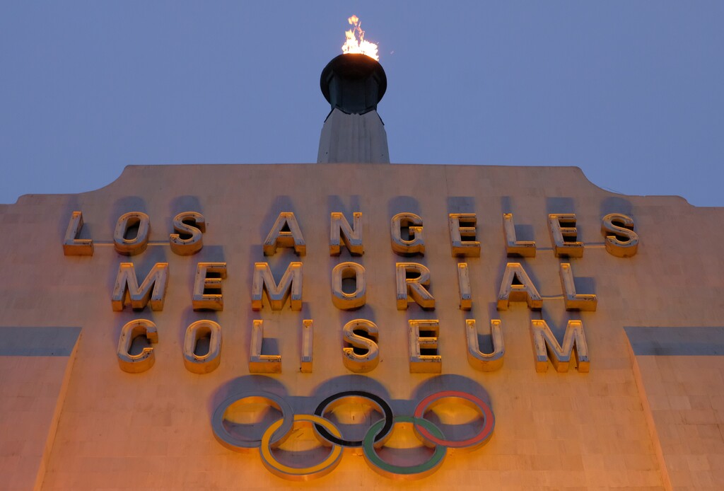 A blazing Olympic cauldron is seen at the Los Angeles Memorial Coliseum on Wednesday, Sept. 13, 2017. The cauldron was lit early Wednesday morning at the stadium that was the site of the 1932 and 1984 Olympics. An International Olympic Committee meeting in Peru is to make it official that LA will host in 2028 and that the 2024 Games will go to Paris. (AP Photo/Richard Vogel)