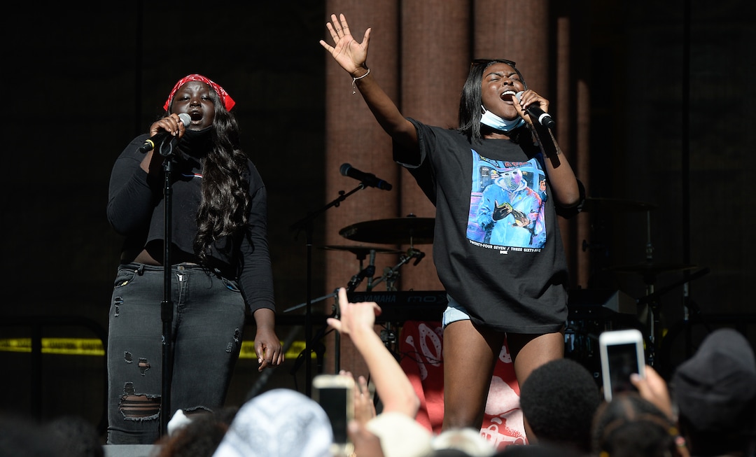 (Francisco Kjolseth  |  The Salt Lake Tribune) Nyalok Akec, left, and Ronata Ibrahim sing during the Juneteenth celebration at Washington Square in Salt Lake City on Friday, June 19, 2020.