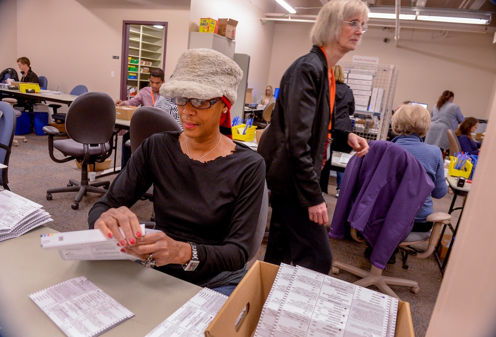 (Leah Hogsten  |  The Salt Lake Tribune)  "It's fun. … I enjoy it," said Salt Lake County elections official Diane McGee of the eight-hour days of inspecting ballots at the Salt Lake County building, Tuesday, Nov. 13, 2018.