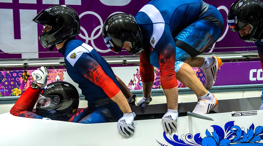 KRASNAYA POLYANA, RUSSIA  - JANUARY 22:The team from Russia, Alexander Zubkov, Alexey Negodaylo, Dmitry Trunenkov and Alexey Voevoda compete in the four-man bobsled at Sanki Sliding Center during the 2014 Sochi Olympics Saturday February 22, 2014. They are currently in first place with a time of 1:50.19. (Photo by Chris Detrick/The Salt Lake Tribune)