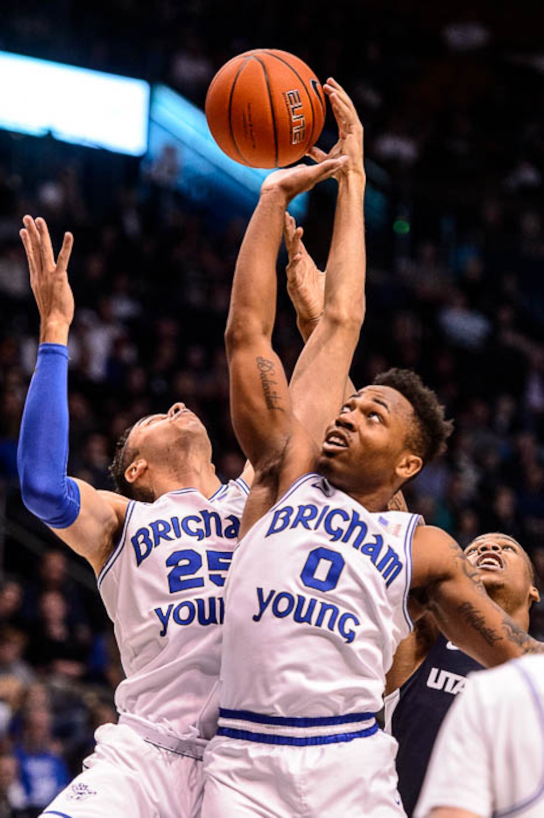 (Trent Nelson | The Salt Lake Tribune)  Brigham Young Cougars forward Gavin Baxter (25) and Brigham Young Cougars guard Jahshire Hardnett (0) rebound as BYU hosts Utah State, NCAA basketball in Provo on Wednesday Dec. 5, 2018.