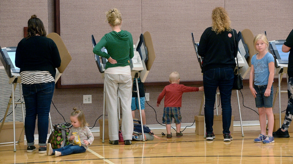 (Al Hartmann  |  Tribune file photo)
People vote at the polling station at South Jordan Founders Park LDS Church in Daybreak-South Jordan on election day Tuesday Nov. 8. Voting was a breeze.  No waiting in lines and children friendy too.