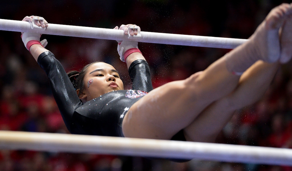 (Leah Hogsten  |  The Salt Lake Tribune) Kim Tessen on the uneven bars as the No. 4 Utah gymnasts host No. 20 Georgia in the final regular season meet at Jon M Huntsman Center in Salt Lake City Friday, March 16, 2018. 