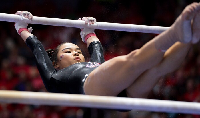 (Leah Hogsten  |  The Salt Lake Tribune) Kim Tessen on the uneven bars as the No. 4 Utah gymnasts host No. 20 Georgia in the final regular season meet at Jon M Huntsman Center in Salt Lake City Friday, March 16, 2018. 