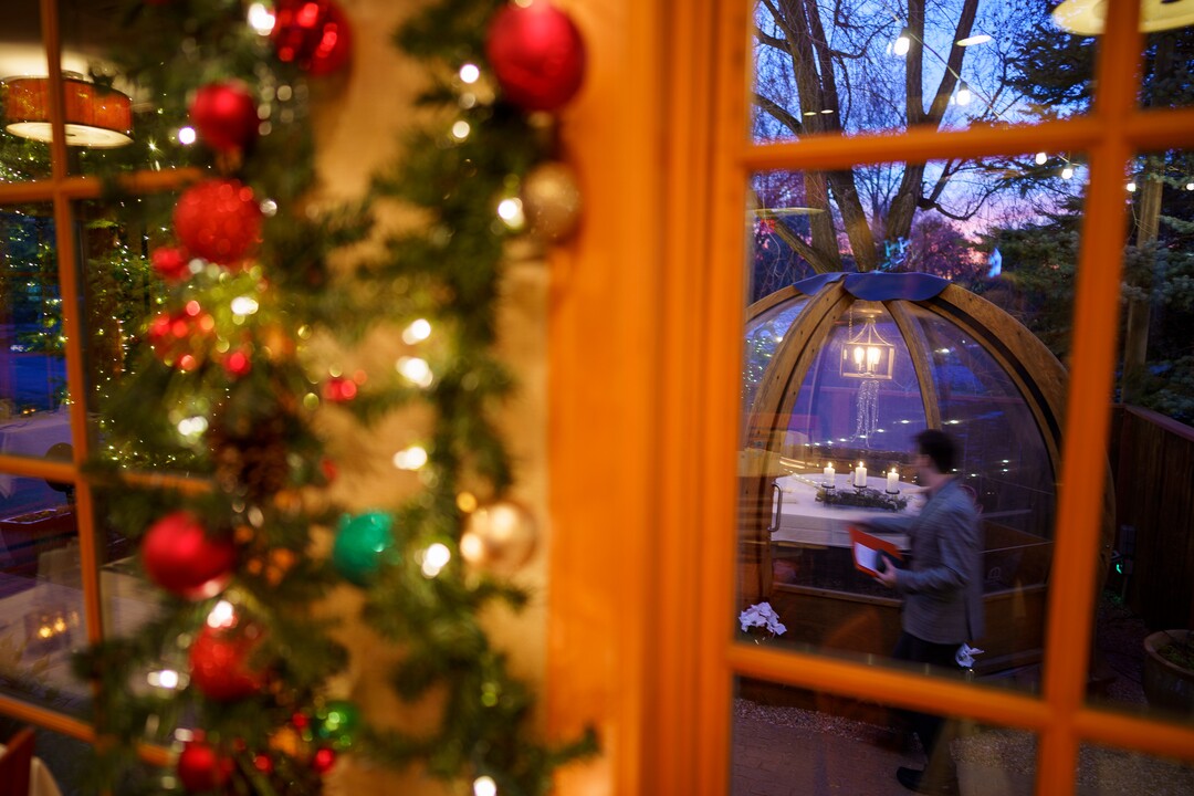 (Trent Nelson  |  The Salt Lake Tribune) Christmas decorations at Franck's Restaurant in Holladay on Saturday, Dec. 4, 2021. Outside the restaurant is an Alpenglobe, a dining shelter.
