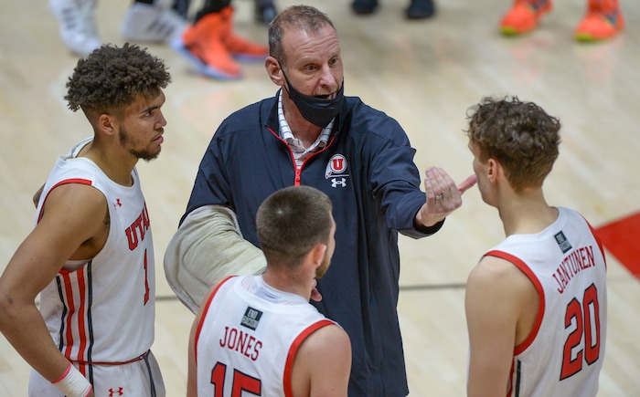 (Leah Hogsten  |  The Salt Lake Tribune) Utah Utes head coach Larry Krystkowiak nurses his right arm after he had surgery to repair a torn elbow tendon. The Utes defeated Idaho State 75-59 during their NCAA basketball matchup Tuesday, Dec. 8, 2020 at the Jon M. Huntsman Center.
