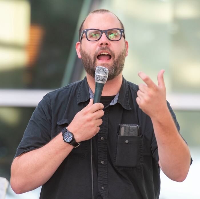 (Rick Egan  |  The Salt Lake Tribune)     Dave Newlin from Utah Against Police Brutality, leads the crowd in a chant, during a protest at the Salt Lake City Police Station, Tuesday, July 23, 2019.