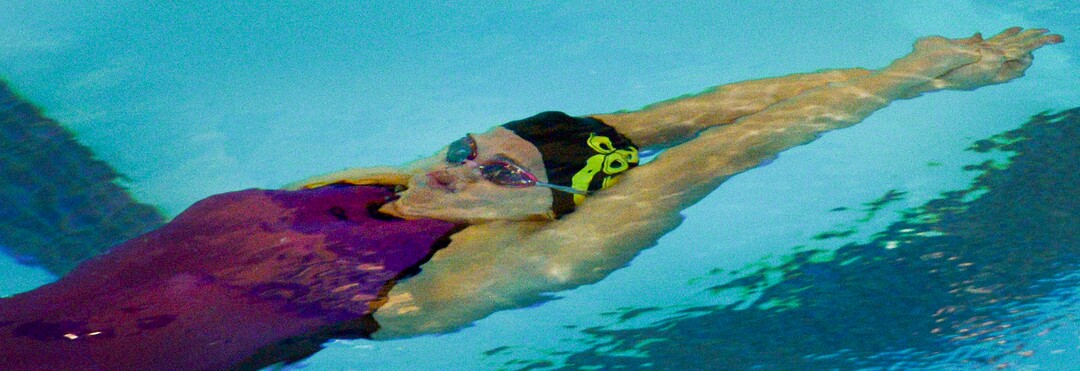 (Leah Hogsten  |  The Salt Lake Tribune)  Cottonwood High School's Rhyan White swims the 100 yard backstroke in 53.55 at the Class 5A State Championships in Bountiful, Saturday, February 10, 2018. 