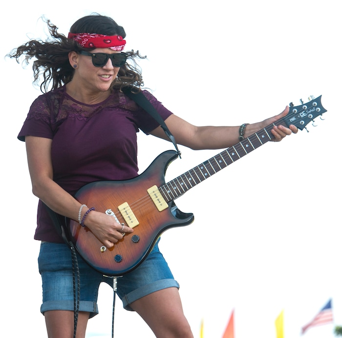 (Rick Egan  |  The Salt Lake Tribune)    
Autumn Butler, from Ogden, was called from the crowd and given a guitar to be a rock star for a day, during the SongBlast Dueling Guitars show at the Utah State Fair Monday, Sept. 9, 2019.
