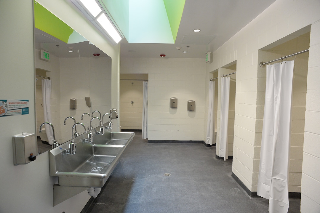 (Francisco Kjolseth  |  The Salt Lake Tribune)  Shelter the Homeless and Catholic Community Services of Utah (CCS) holds a public open house at the Gail Miller Resource Center on Friday, Sept. 6, 2019, with self-guided tours for the public to see the brand new building and learn about the services that will be provided there for both men and women. Pictured is the men's shower area.