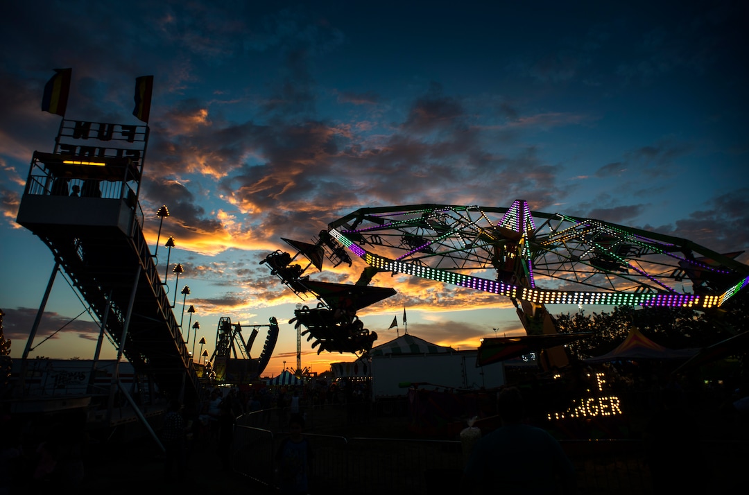 (Rick Egan  |  The Salt Lake Tribune)   The Midway at the Utah State Fair lights up as the sunsets, Monday, Sept. 10, 2018.