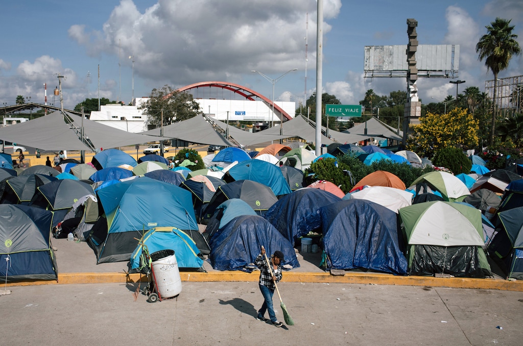 (Alyssa Schukar | The New York Times) A woman sweeps at an encampment in Matamoros, Mexico, which is home to hundreds of migrants seeking asylum in the United States, on Nov. 7, 2019. A federal court on Friday, Feb. 29, 2020, upended a central pillar of the Trump administration’s immigration agenda, ruling that asylum seekers must be allowed into the U.S. while their often lengthy cases meander through American immigration courts.