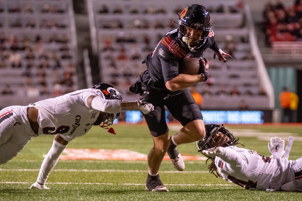 (Rick Egan | The Salt Lake Tribune) Utah wide receiver Creed Whittemore (80) breaks a couple of tackles to score a touchdown for Utah on Saturday, Nov. 1, 2025.

