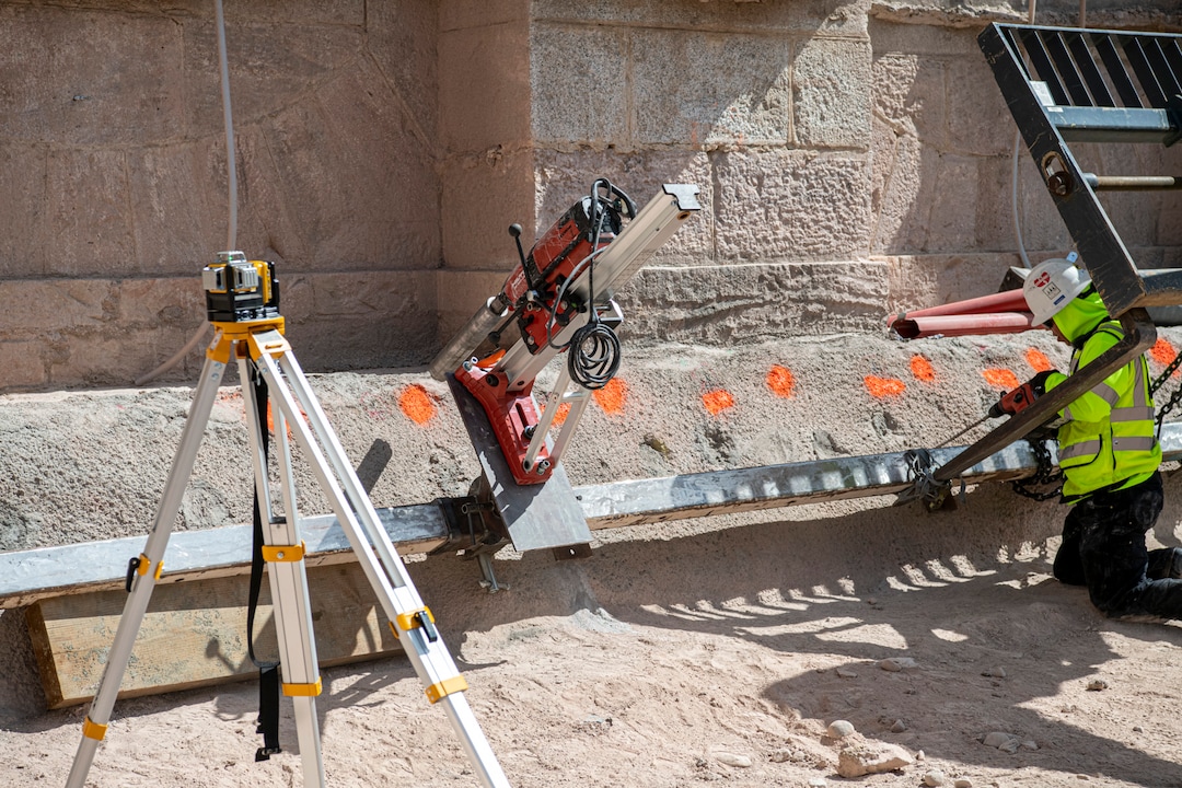(Photo courtesy of The Church of Jesus Christ of Latter-day Saints) The equipment photographed here calculates and lines up a machine that drills holes at different angles into the foundation of the Salt Lake Temple. The process, called coring and drilling, ultimately fills voids in the foundation with concrete grout in preparation for installing huge bearings called base isolators, part of the structure’s seismic upgrade against high magnitude earthquakes.