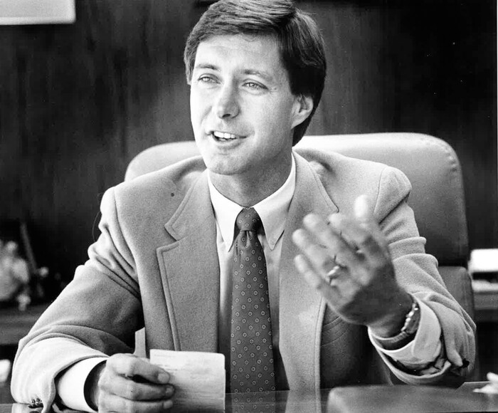 (Tribune File Photo)  University of Utah Athletic Director Dr. Chris Hill gives an interview to the Tribune in his office, November of 1987. The 37- year-old Hill was named athletic director a month earlier and he talked his objectives in administering the schools approximately $6 million athletics budget.