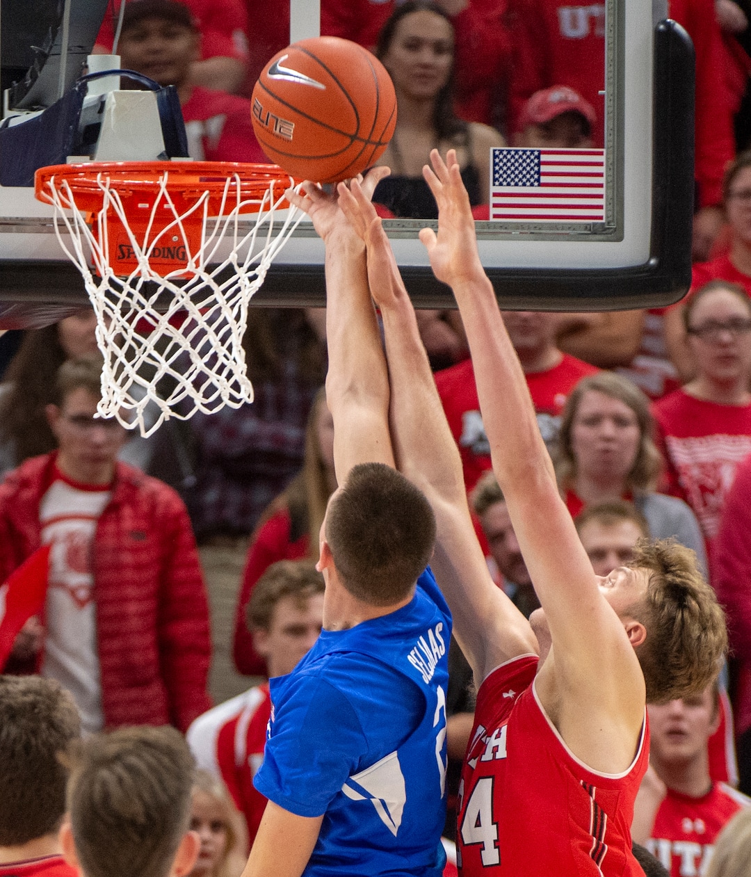 (Rick Egan  |  The Salt Lake Tribune)   Brigham Young Cougar guard, Zac Seljaas goes to the hoop, as Utah Utes center Jayce Johnson (34) defends, in basketball action in the Beehive Classic, between against the Brigham Young Cougars and Utah Utes, a the Vivint Smart Home Arena, Saturday December 8, 2018.