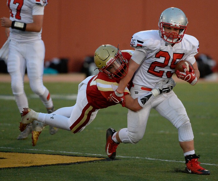 (Francisco Kjolseth  |  The Salt Lake Tribune)  Blaine Cockett of Judge goes for a ride as he tries to take down Jace Miller of Manti in the Class 3A football playoff game in the Class 3A football playoff game at Judge Memorial on Thursday, Oct. 19, 2017. 