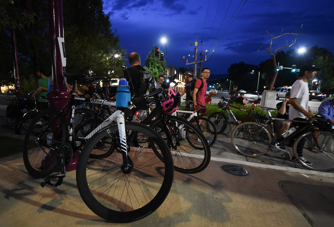 (Francisco Kjolseth  |  The Salt Lake Tribune)  A large group of cyclist gathers on the corner of 9th and 9th at 9pm in Salt Lake City on Thursday, July 26, 2018, for the weekly ride that has become known as the 999 Ride. The inclusive, all-welcoming slow casual social ride happens year round on Thursday nights, with riders often pedaling into the early morning hours. Newly released video shows rider Cameron Hooyer being struck and killed by a FrontRunner train at a downtown railroad crossing during last weeks ride when the 22-year-old failed to stop or heed the warning signals before crossing the tracks during the group ride. 
