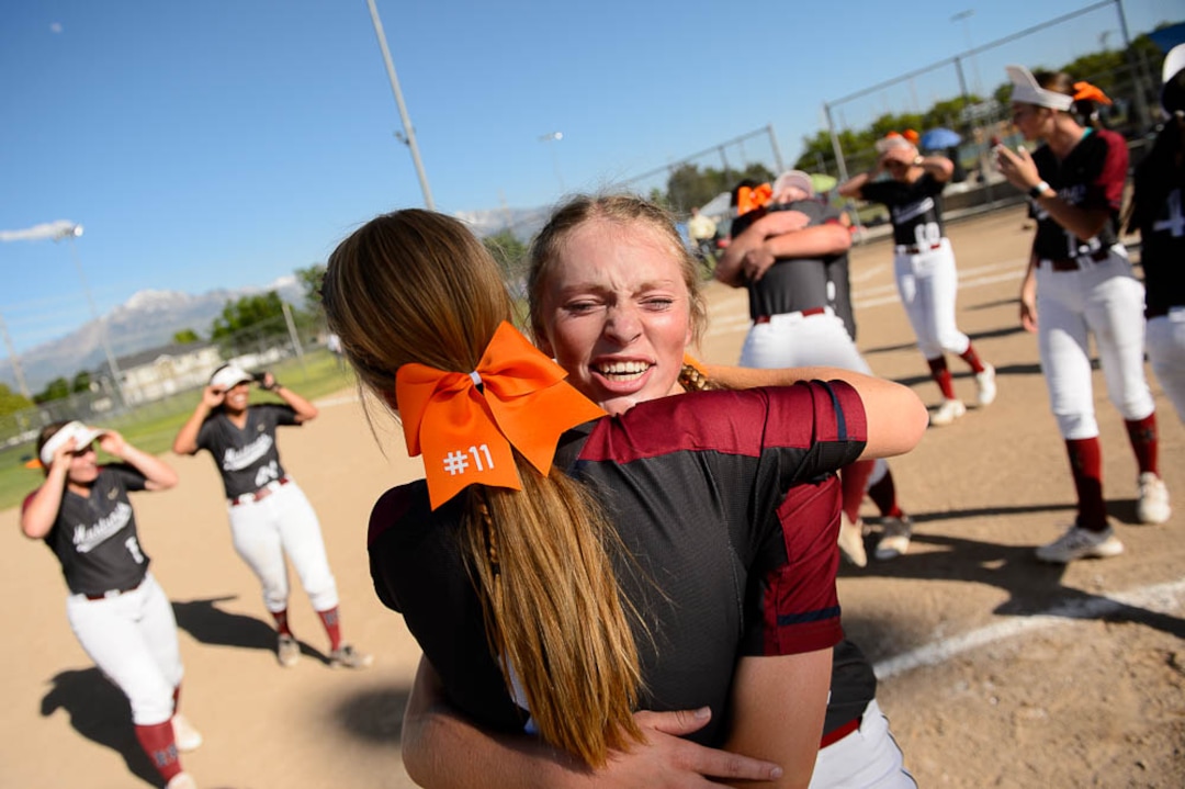 (Trent Nelson | The Salt Lake Tribune)Herriman players celebrate a win over Syracuse in the 6A Softball State Championship game, Thursday May 24, 2018. Herriman's Kiley Avery (8) and Herriman's Kaitlyn Slade (10) embrace.