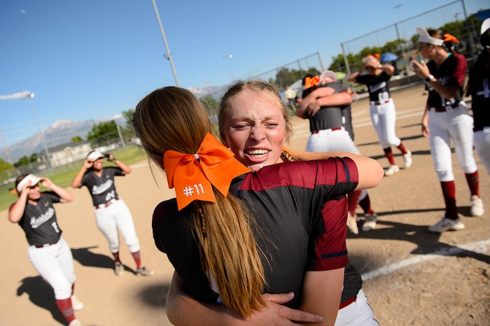 (Trent Nelson | The Salt Lake Tribune)
Herriman players celebrate a win over Syracuse in the 6A Softball State Championship game, Thursday May 24, 2018. Herriman's Kiley Avery (8) and Herriman's Kaitlyn Slade (10) embrace.