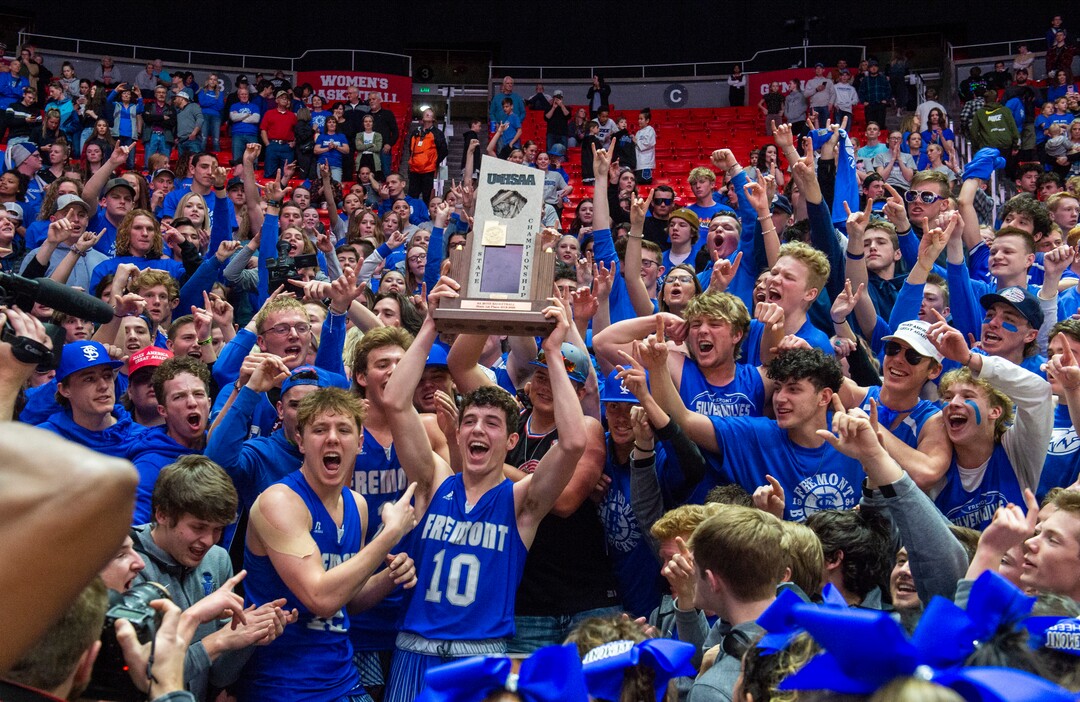 (Rick Egan  |  The Salt Lake Tribune)    Fremont's Baylor Harrop (10), holds the trophy as the Silverwolves celebrate their 55-52 win over the Davis Darts, in the 6A basketball championship game at the Jon M. Huntsman Center, Saturday Feb. 29, 2020