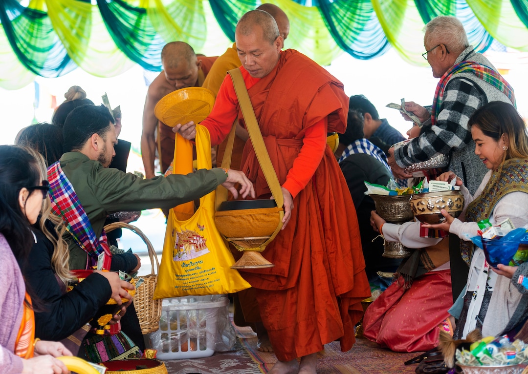 (Rick Egan  |  The Salt Lake Tribune)    Participants make donations to the monks, at the Wat Lao Salt Lake Buddharam Utah, New Year Celebration, in West Valley City, Sunday, April 28, 2019.