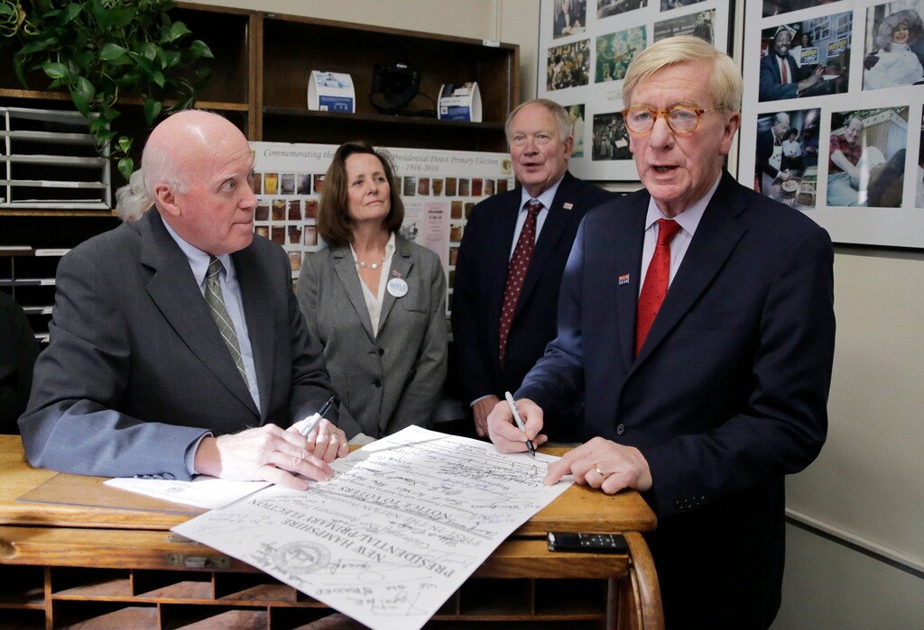 (Charles Krupa | AP) Republican presidential candidate former Massachusetts Gov. William Weld, right, files to have his name listed on the New Hampshire primary ballot, Wednesday, Nov. 13, 2019, in Concord, N.H. At left is New Hampshire Secretary of State Bill Gardner.