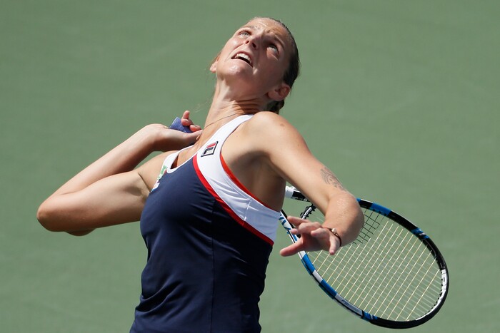 Karolina Pliskova, of the Czech Republic, serves to Camila Giorgi, of Italy, at the Western & Southern Open tennis tournament, Friday, Aug. 18, 2017, in Mason, Ohio. (AP Photo/John Minchillo)
